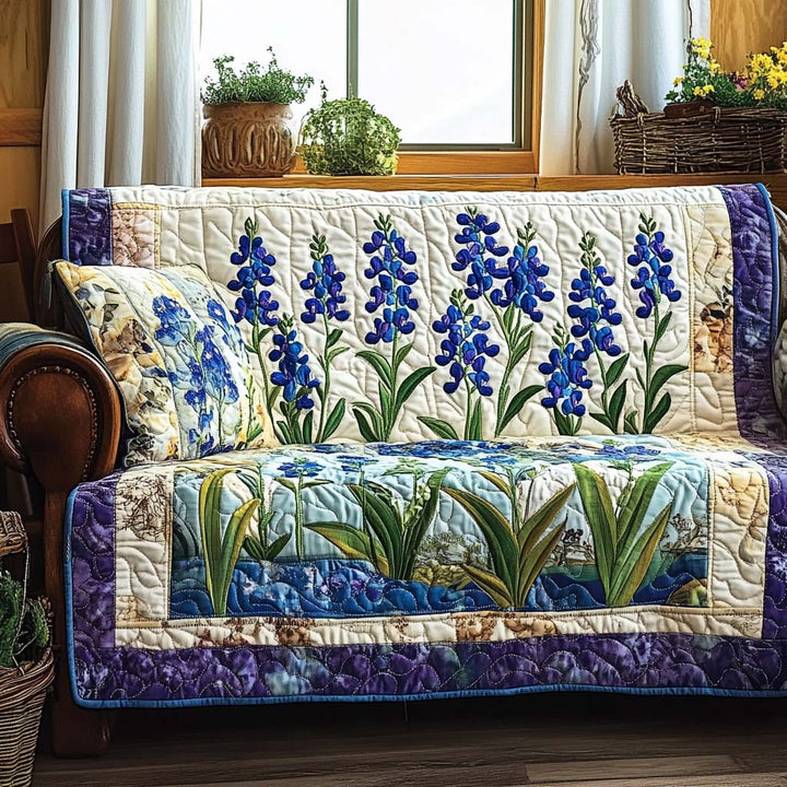 Quilted sofa cover with blue wildflowers – Louise London