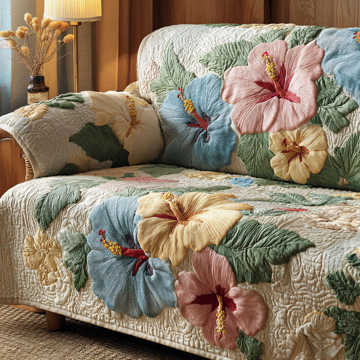 Quilted sofa cover with hibiscus – Louise London
